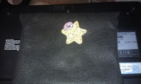 It closes with a plastic snap button.