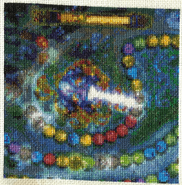 My mom started this one and I finished it.  I was in such a hurry to get it mailed out that I didn't get it quite lined up in the scanner, oops!