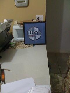 They're a little difficult to frame due to the tacs sticking through the back of the corkboard... but I just muscle them in... :P