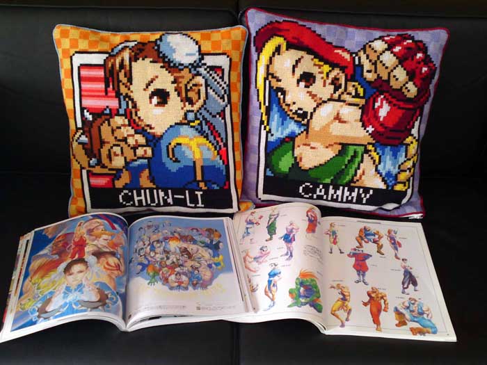 my two retro Capcom cushions (and my hard-to-get-hold-of Capcom art books!)