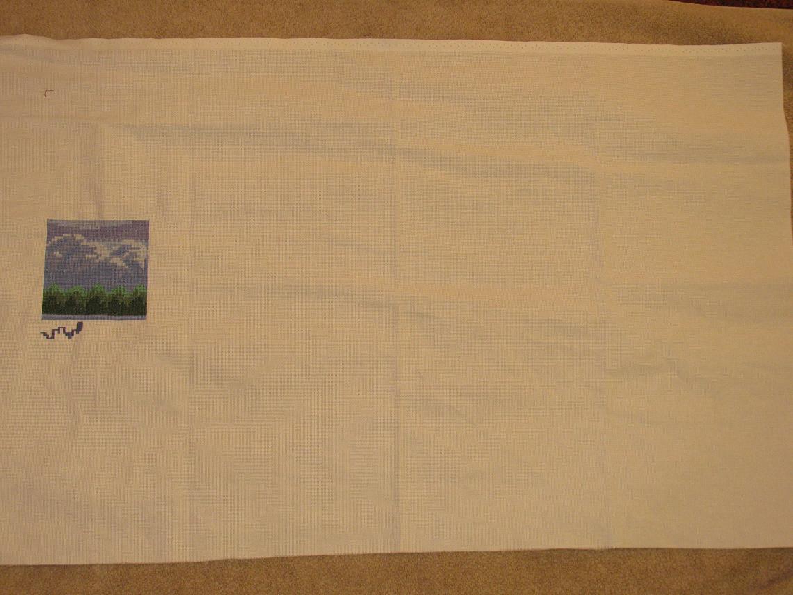 Progress. The mountains &amp; trees are done on this page. Now working on the water reflection of the treeline.